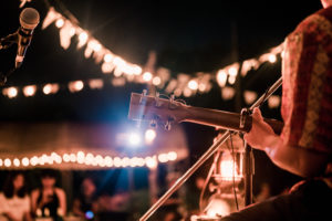 Musicians playing guitar at music festival